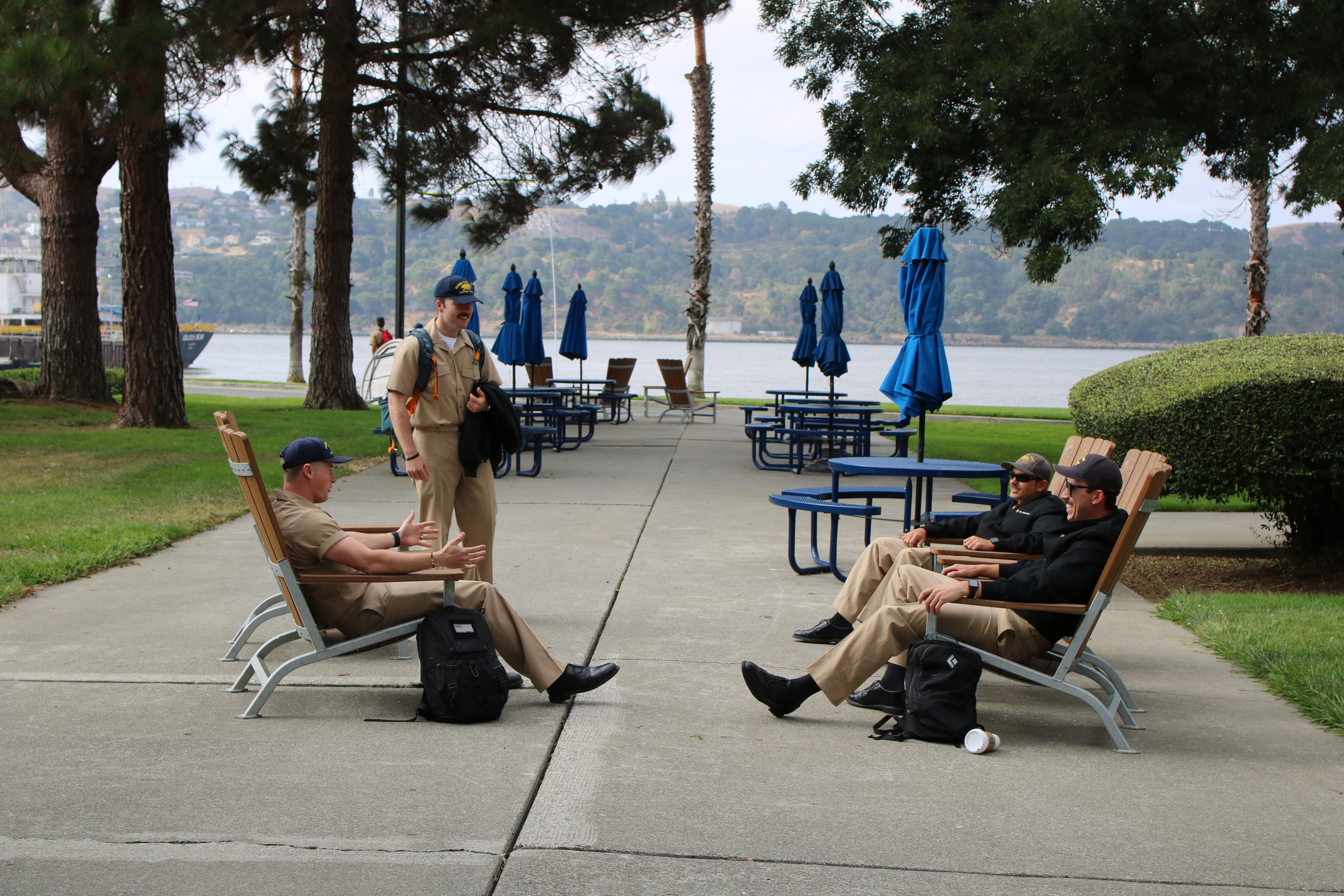 Cadets relax on chairs on campus waterfront