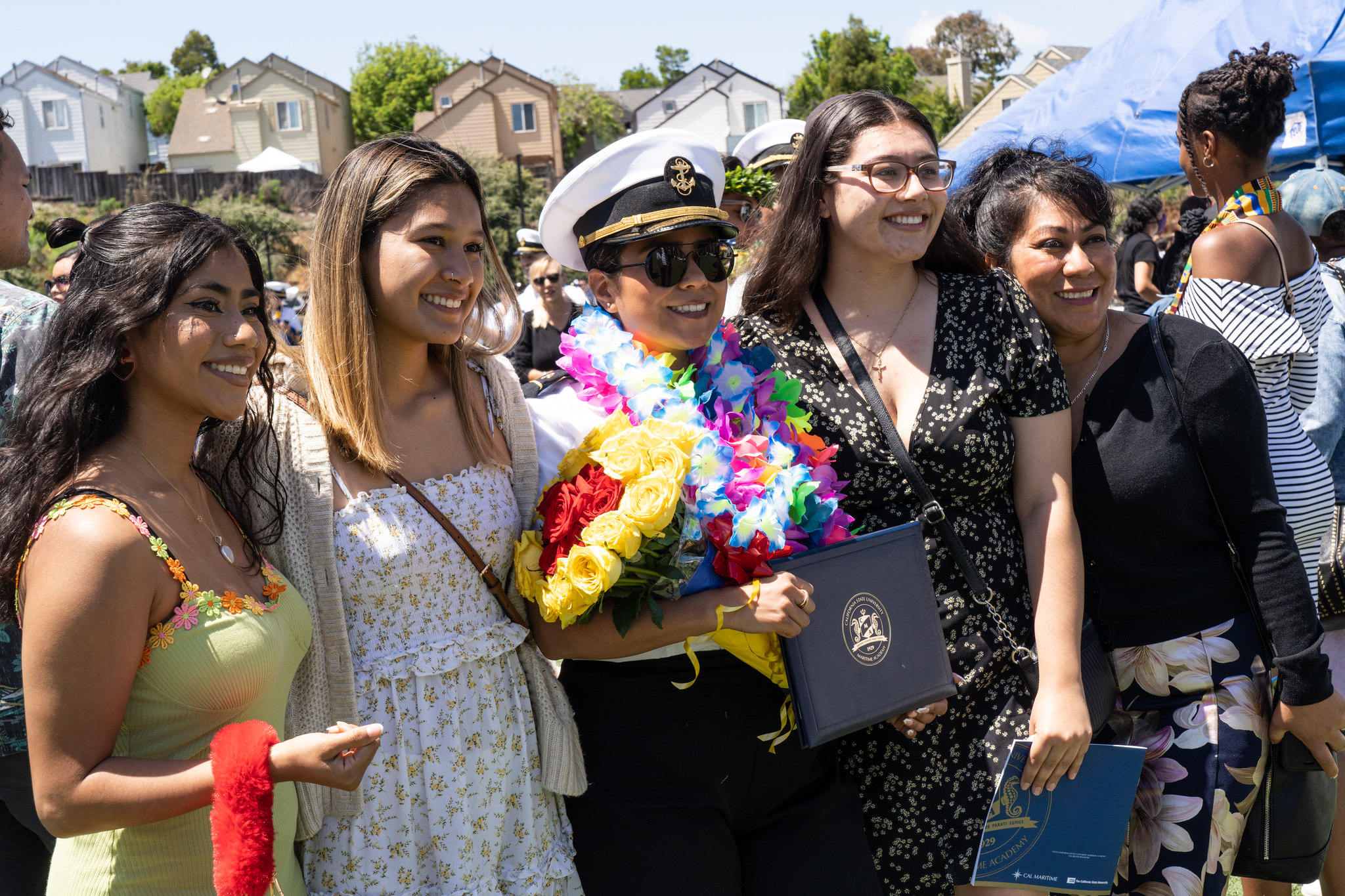 Commencement photo with a cadet and her family