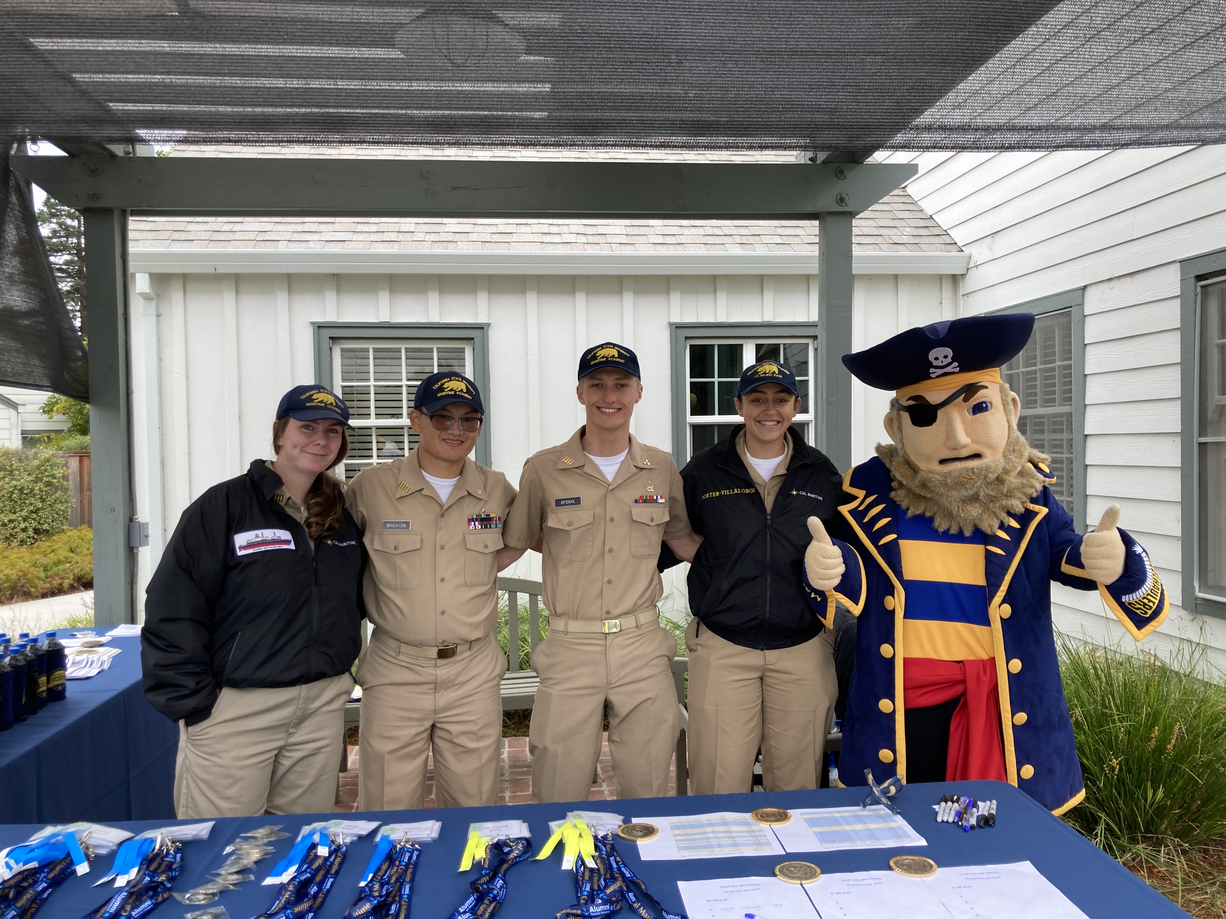 Cadets in Khakis with Golden Beard mascot during Alumni Reunion Weekend