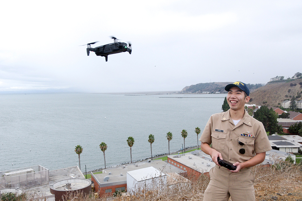 Oliver Chen with drone on campus