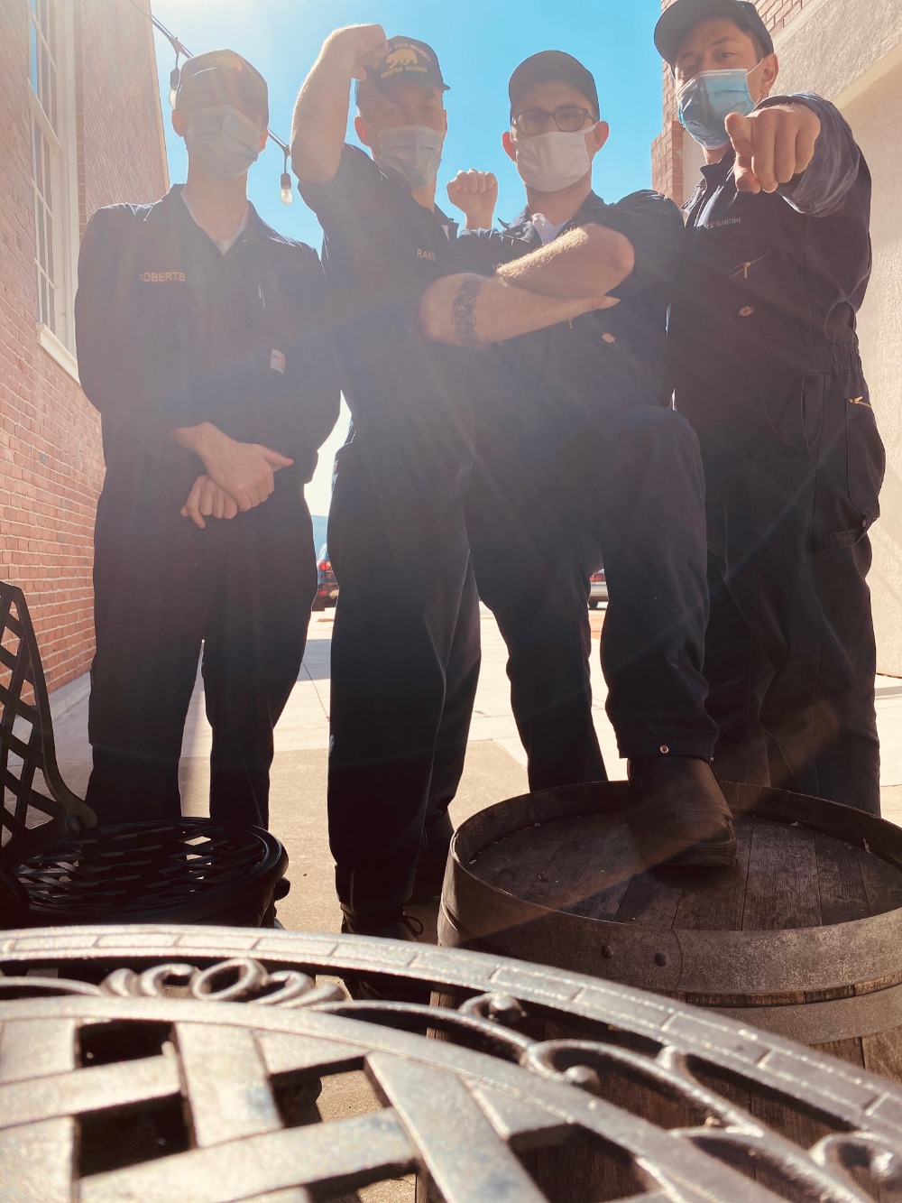 Group of cadets pointing at camera