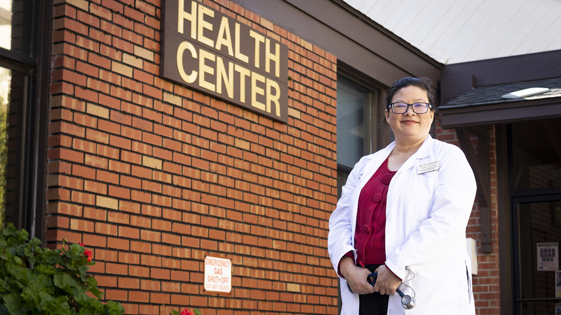 Dr. Grace Chou in front of Student Health Center building