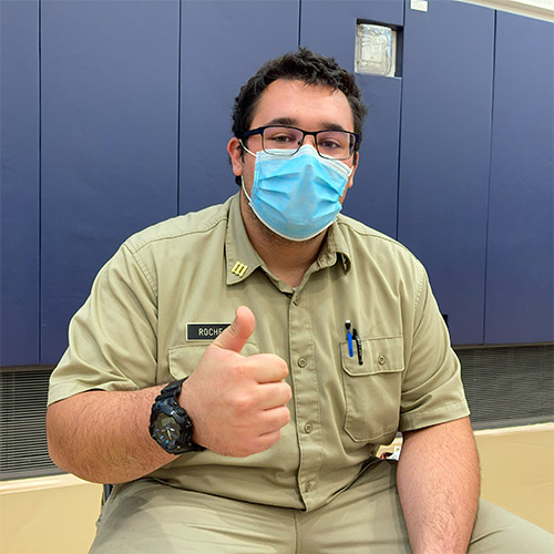 Cadet with thumbs up after receiving vaccine