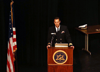 Commander Van Spanje at podium