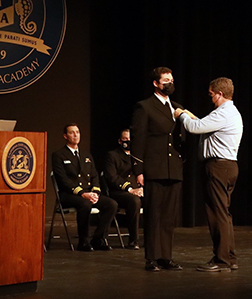 Zachary Crawford with his father on stage