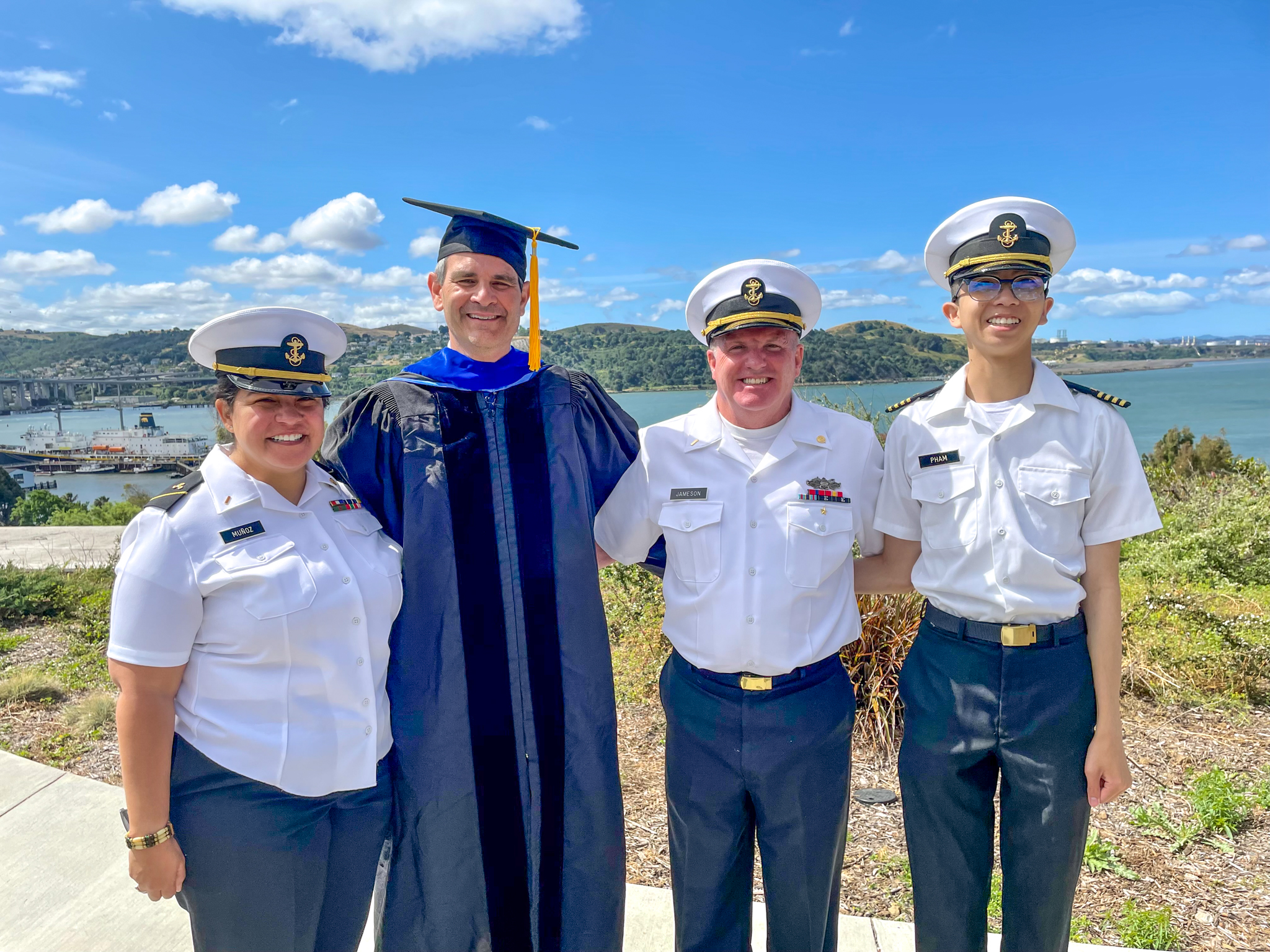 Dr. Alex Parker is flanked by the first three graduates of Cal Maritime’s newest oceanography major. Left of Parker is Olivia Mũnoz, to his right is Seamus Jameson and Justin Pham, all members of the Class of ’22
