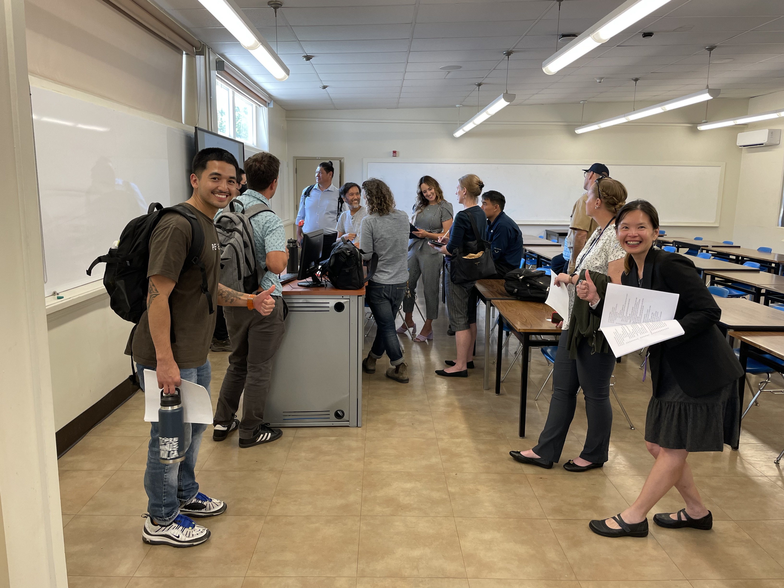 Jase Teoh (right) and her team test out some features as faculty experiment with classroom technology during faculty orientation over the summer.