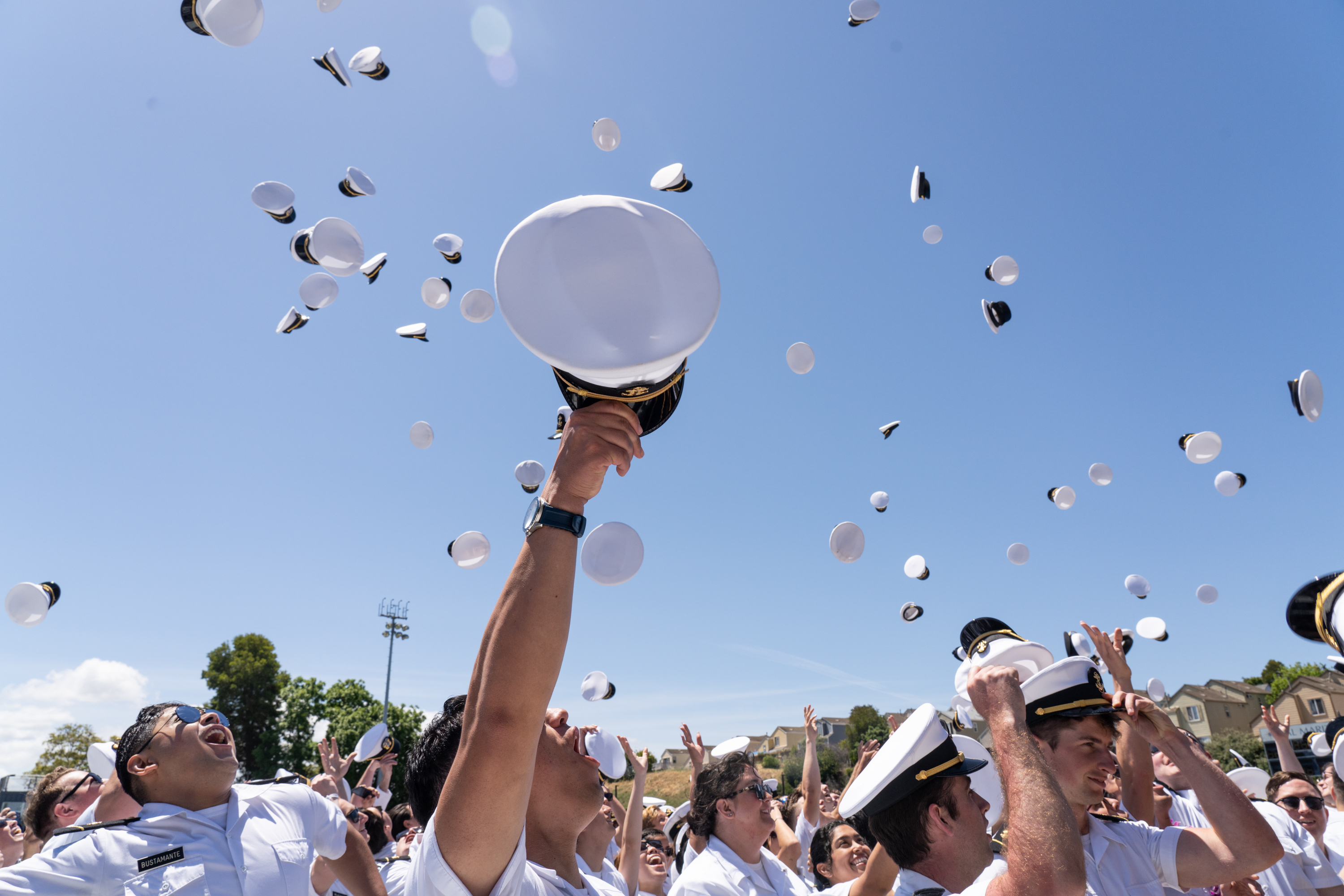 Graduates toss their caps in celebration