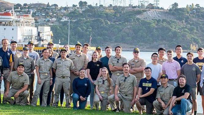 Collegiate wind competition team in front of Training Ship Golden Bear