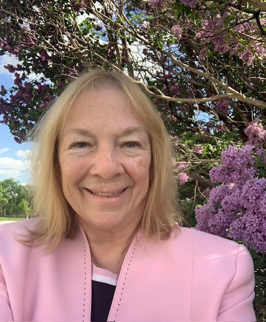 Dr. Hellwig in front cherry blossoms
