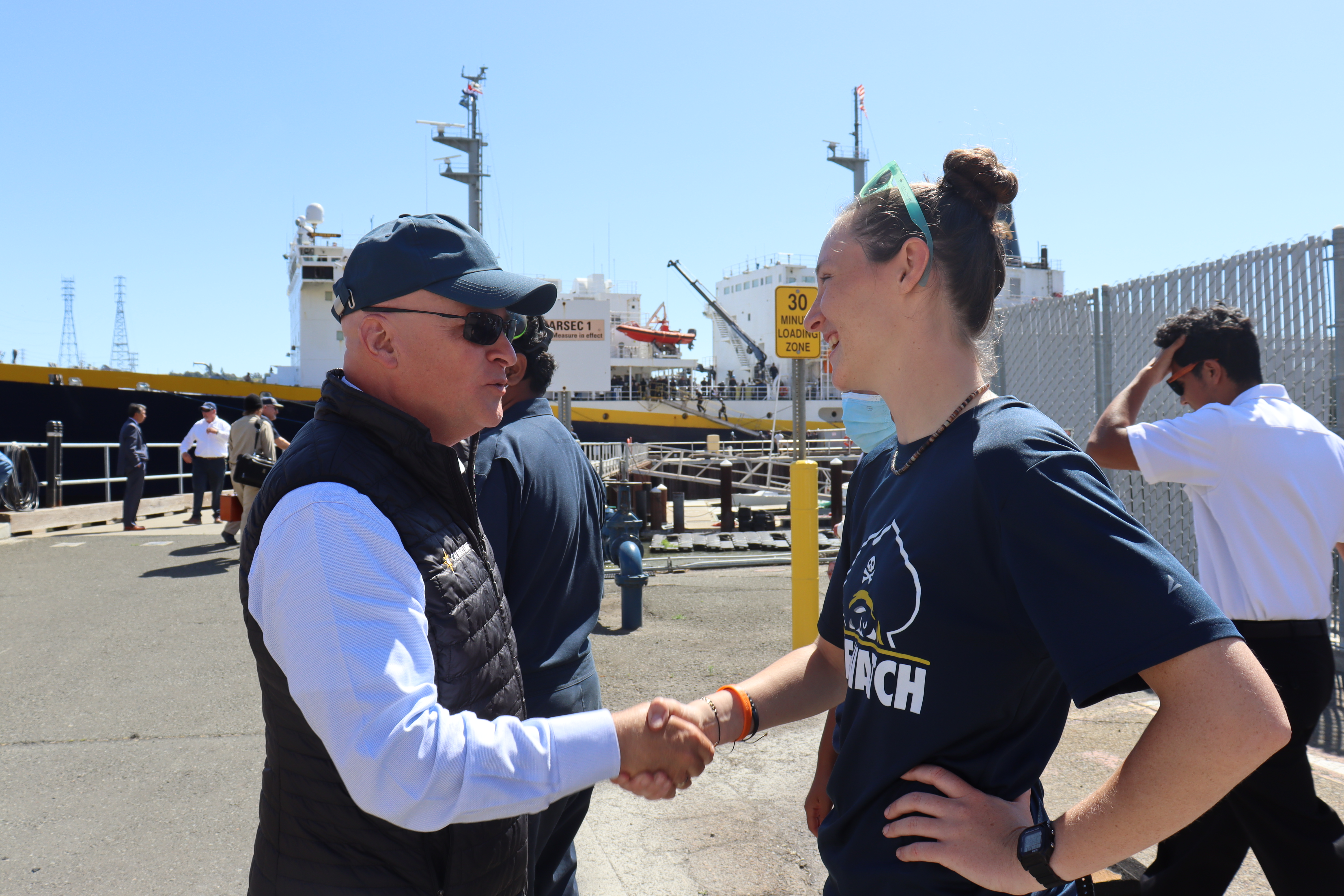 Interim President Dumont shaking hands with a summer cruise cadet during the TSGB's arrival in Vallejo