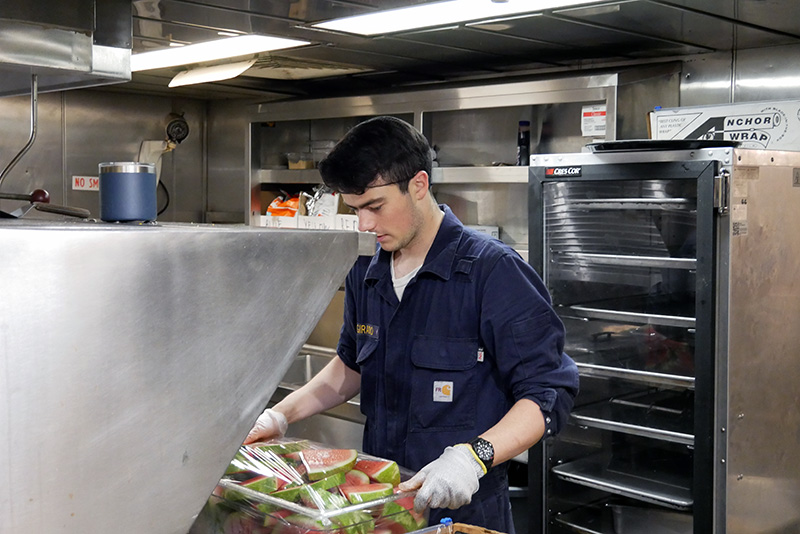 Cadet Giraudo preparing watermelon