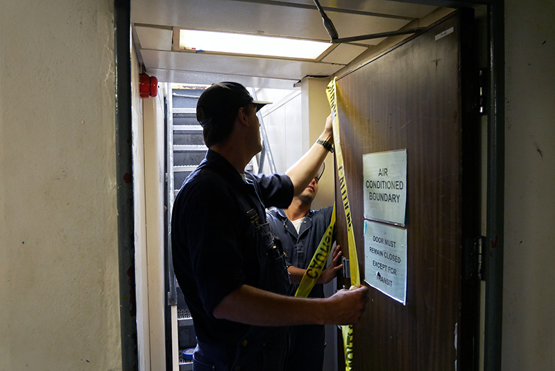 Cadet taping off door
