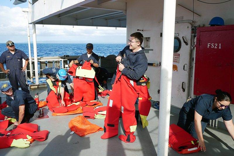 Cadet putting on suit