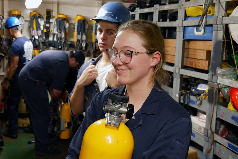 Cadet Bailey holding an SCBA bottle