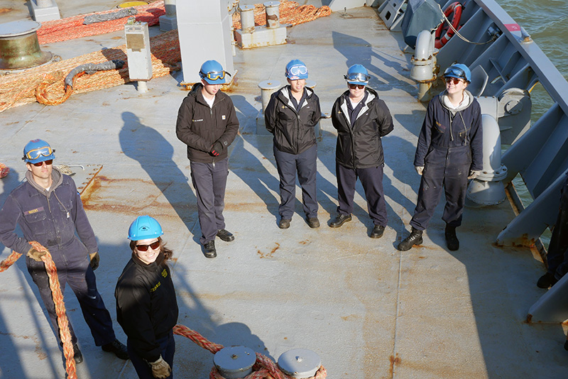 Group of cadets smiling on ship