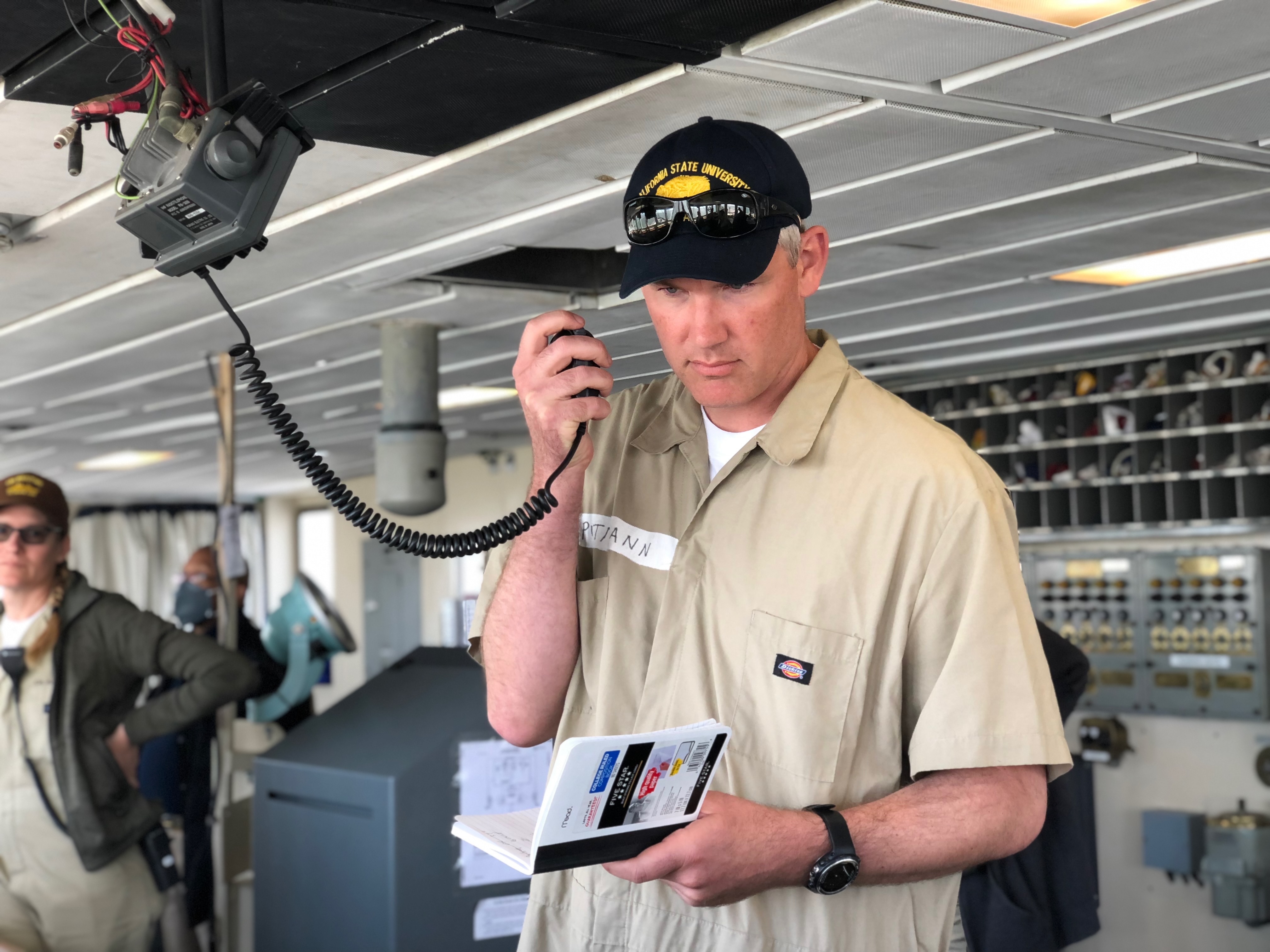 Cadet Bill Puttman on the comms speaking with Vessel Traffic Contol (VTC)