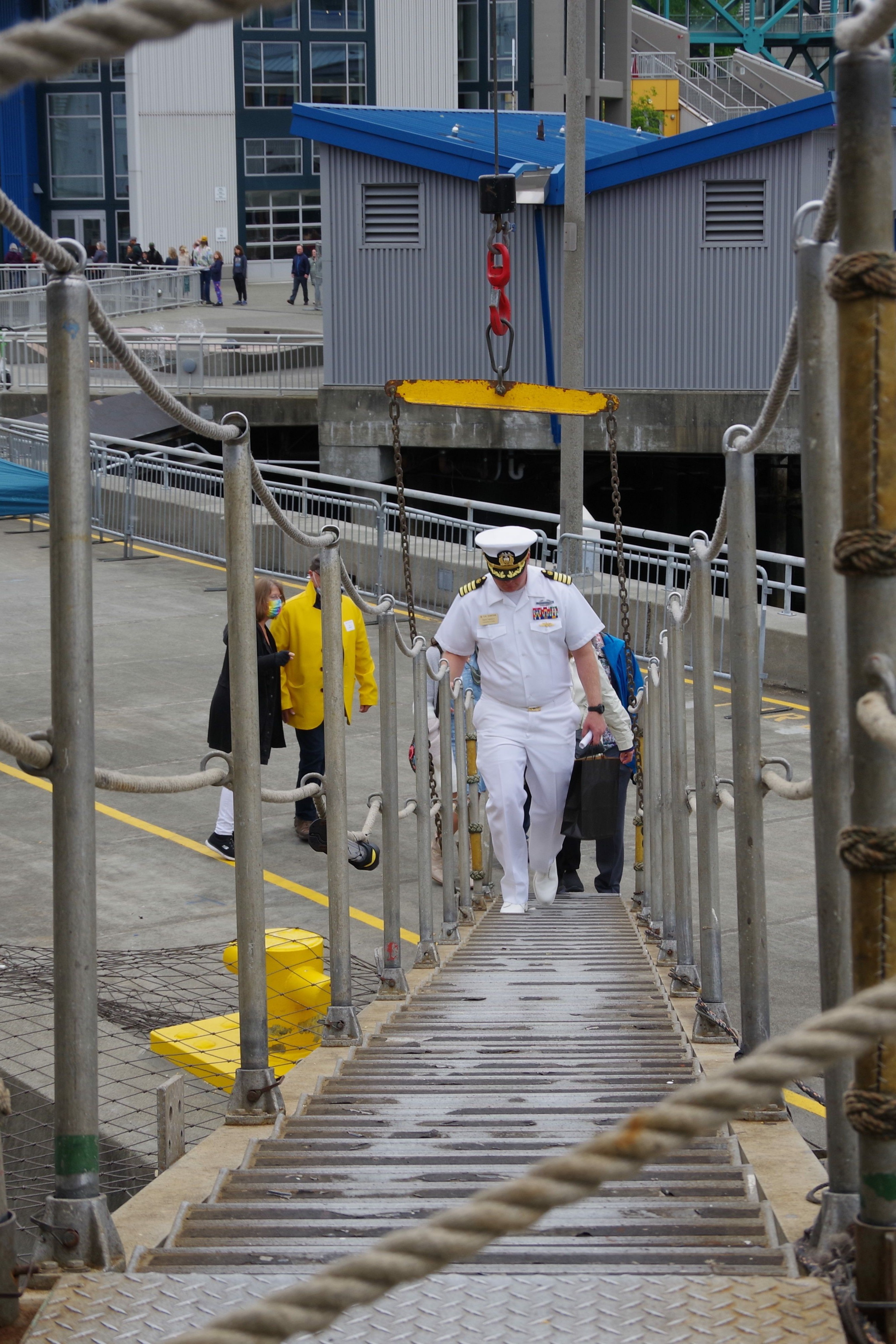 Commandant David Taliferro leading a group of visitors up the gangway- Photo credit- Emily Robison