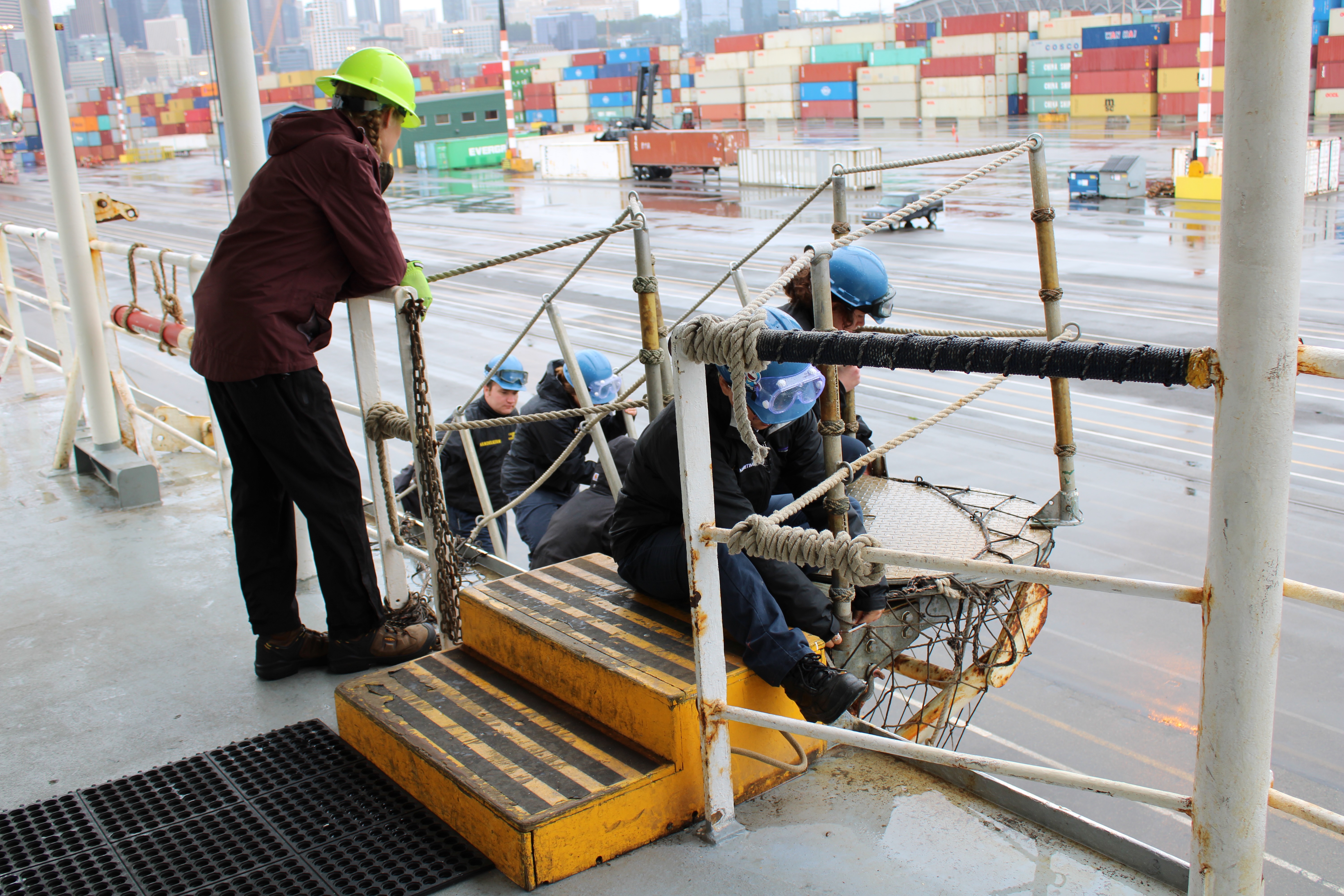 2nd Mate Compliance Officer observing as "save all" net is stripped