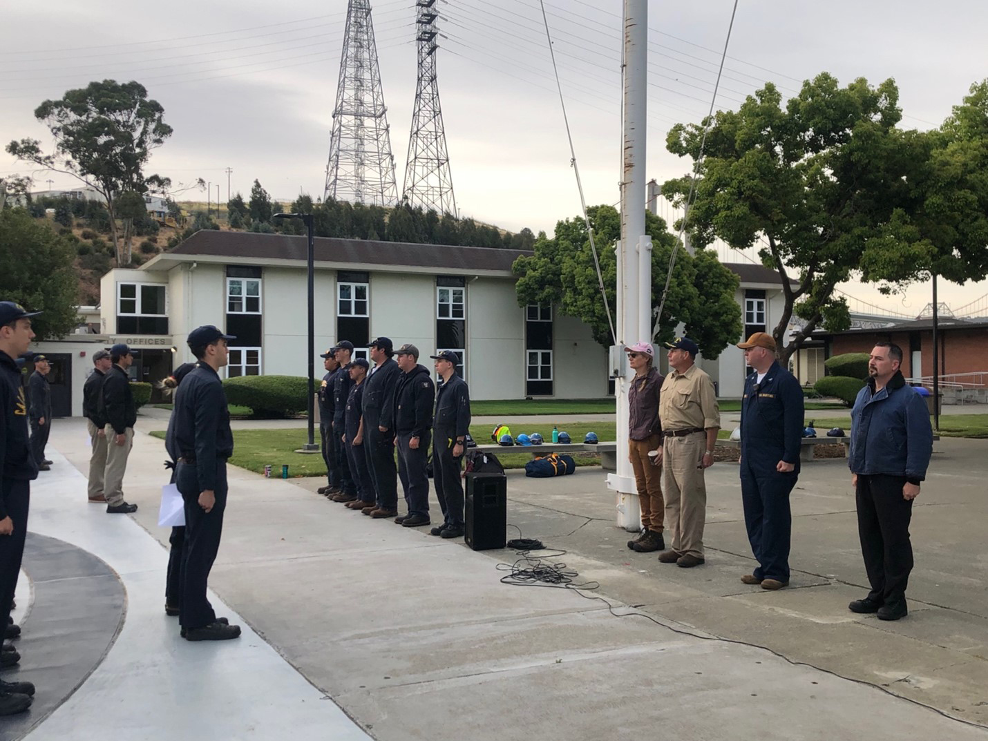 Ship's corps staff and ships leaders face the rest of the corps during morning formation