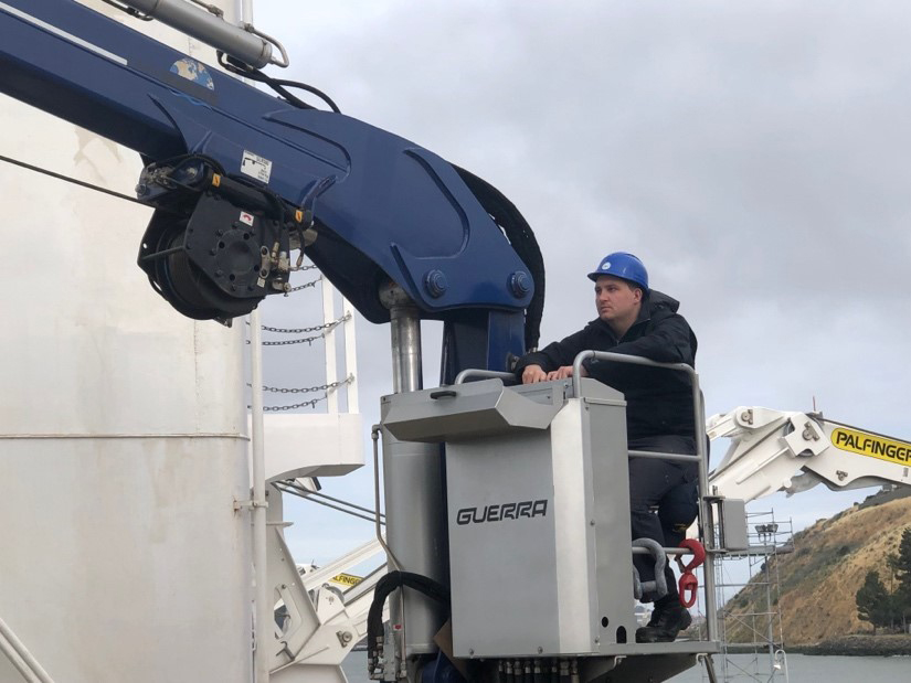 Jake Schollenberg- 4th deck division commanding officer (4D CO) operates the crane during day work and moves supplies onto the ship