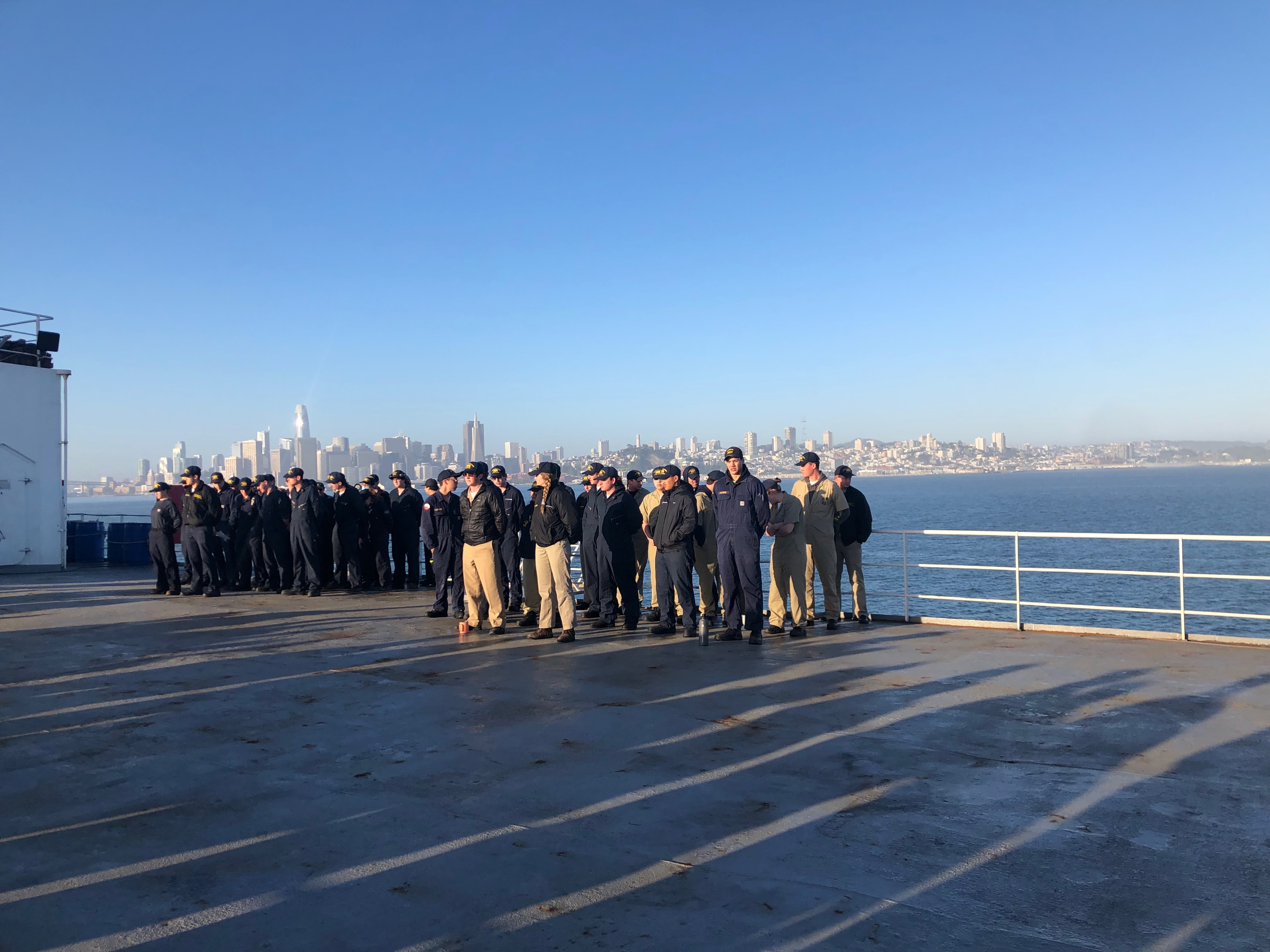 Cadets at formation with the San Francisco skyline in the background