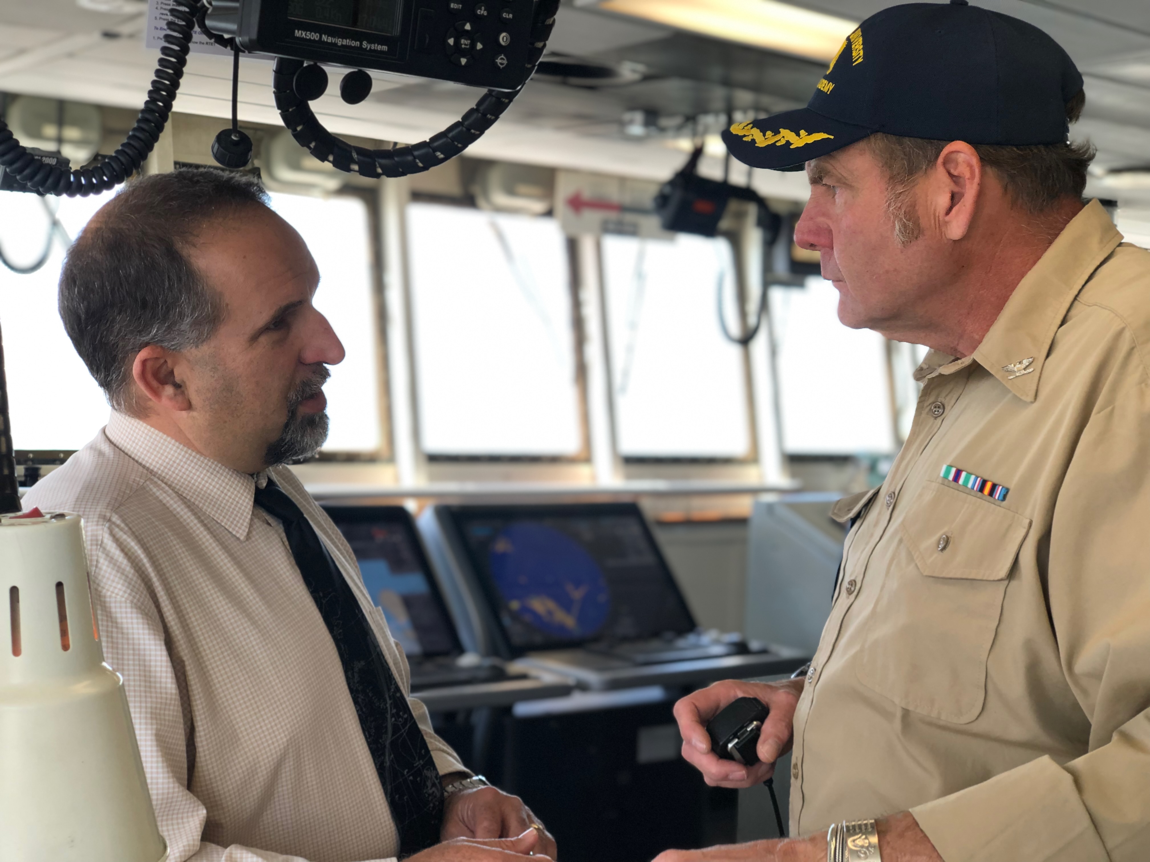 Captain and Pilot Mark talk about their plans for departure before the ship begins making way